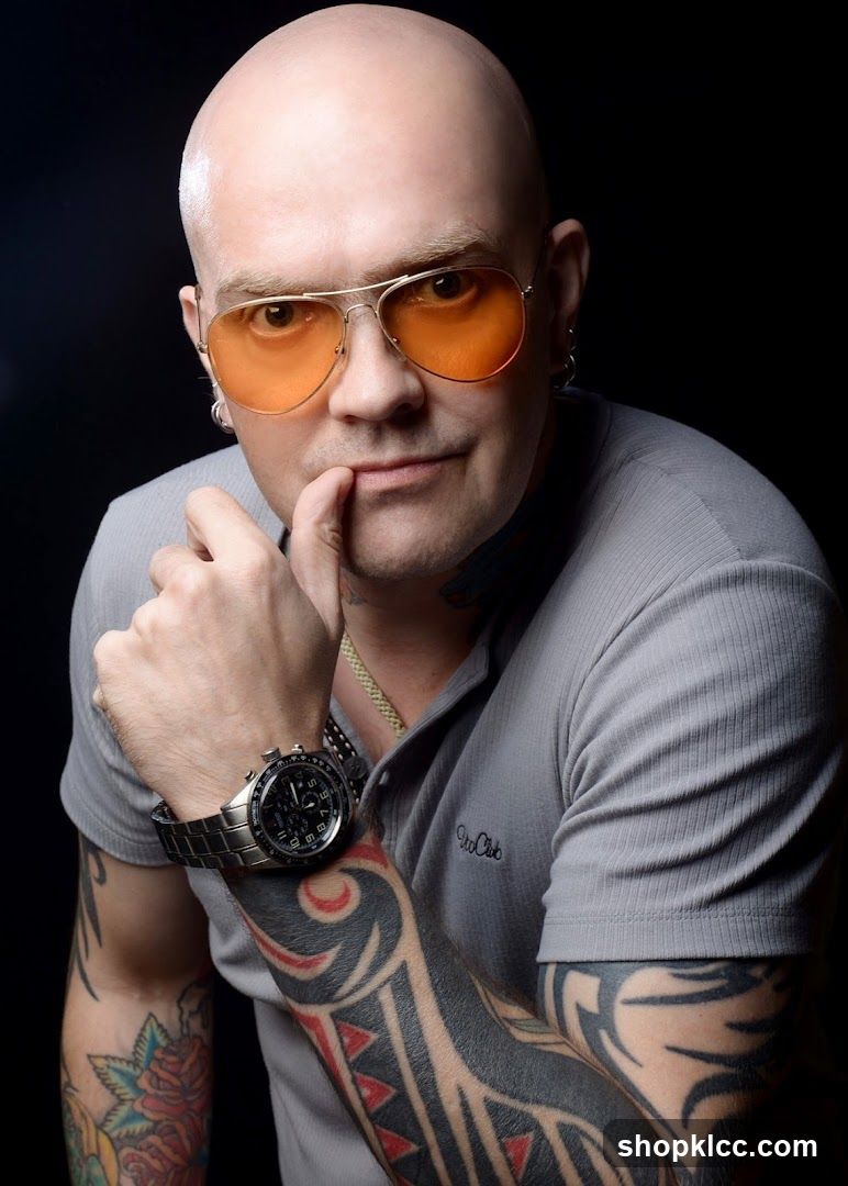Portrait of a man with tattoos and sunglasses