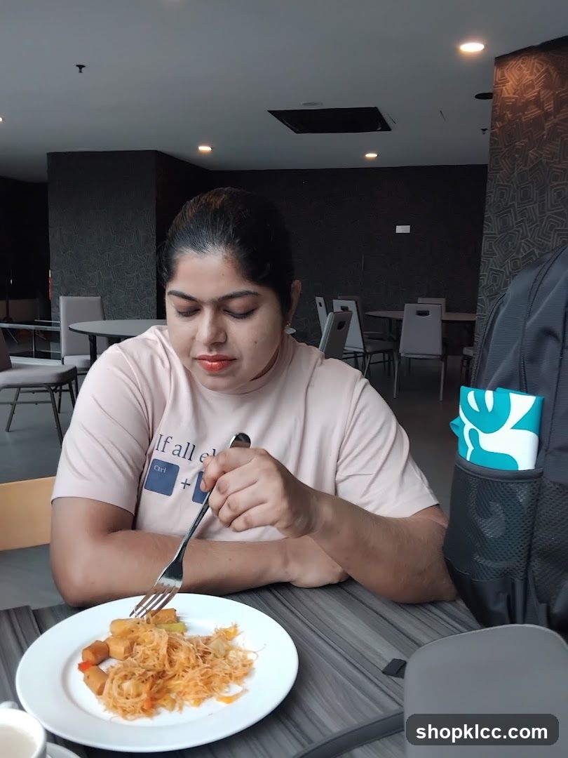 Person eating at a restaurant table