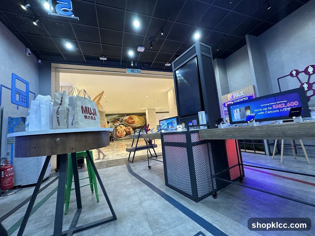 Interior of a retail space with Muji bags and electronics display