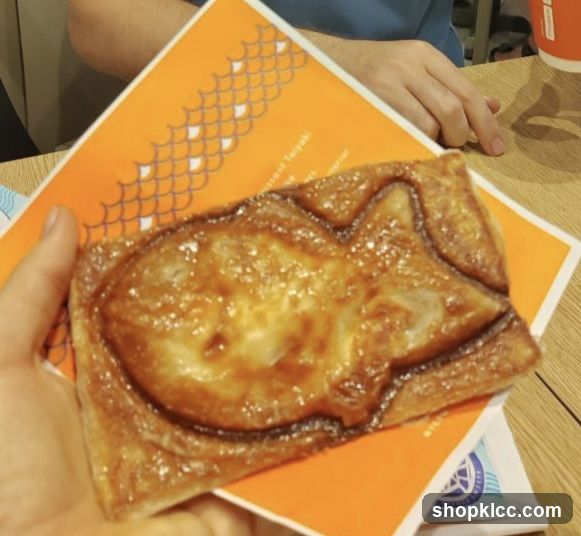 Cat-shaped pastry on orange card