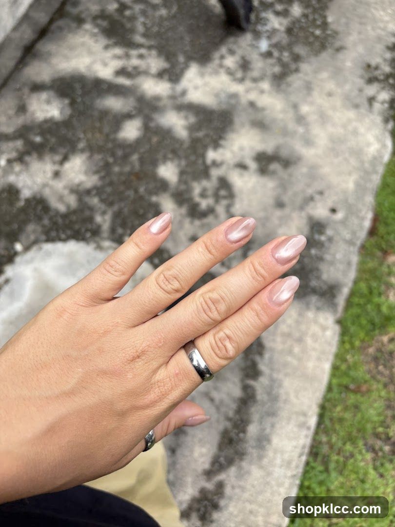 Hand with manicured nails and ring