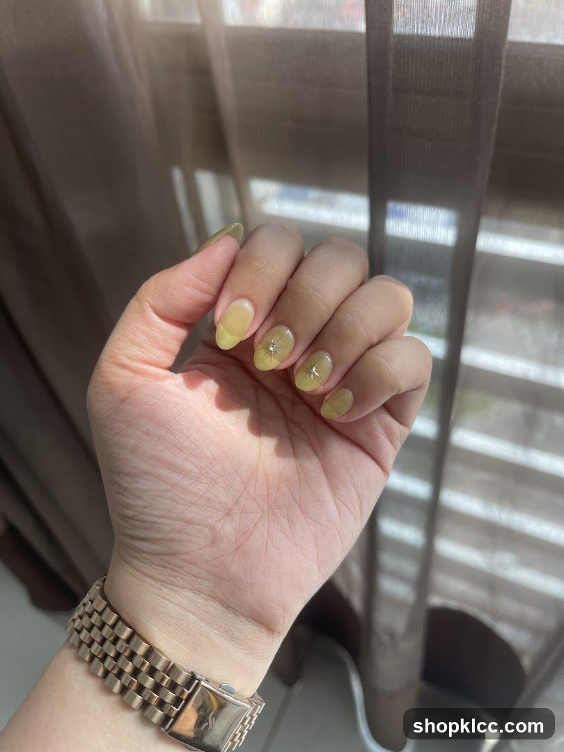 Hand with Yellow Nail Art