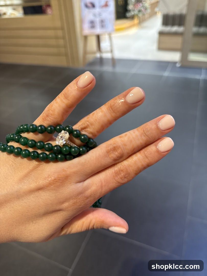 Hand with Green Beaded Bracelet and Ring