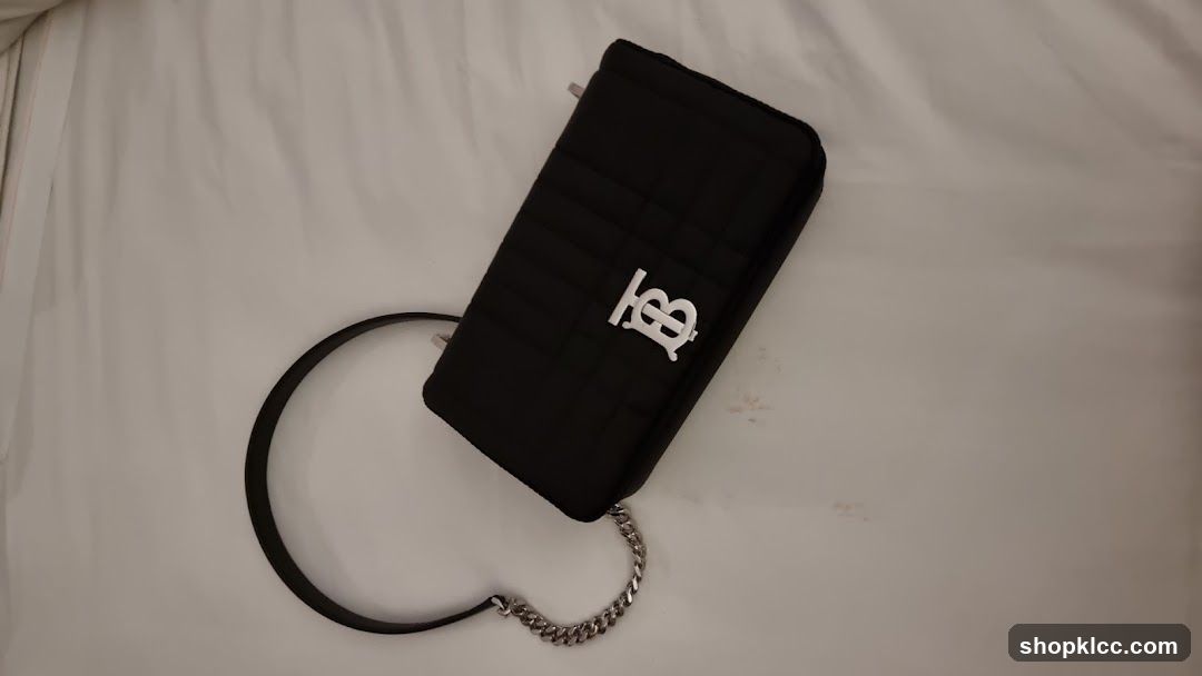Black quilted handbag with logo