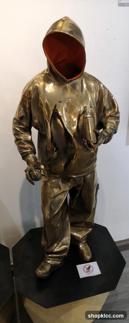 Bronze Sculpture of a Person in a Hoodie