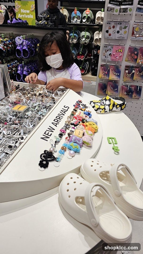 Girl Browsing Charms in a Shoe Store