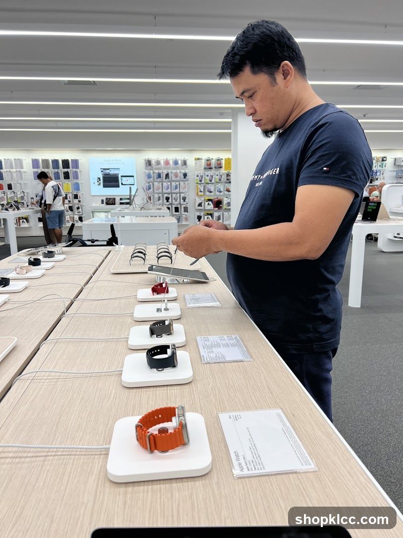 Man examining smartwatches in a store