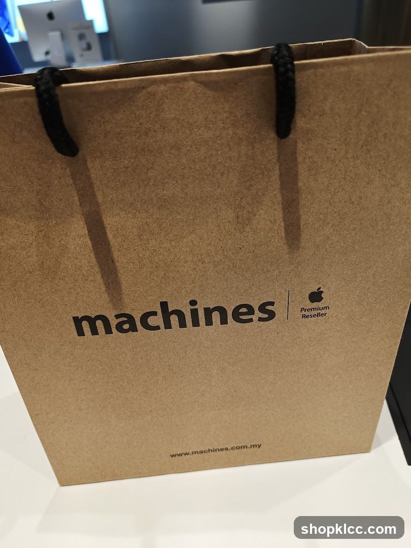 Brown paper shopping bag with "machines" logo