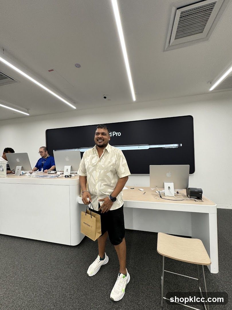 Man holding a shopping bag in a store