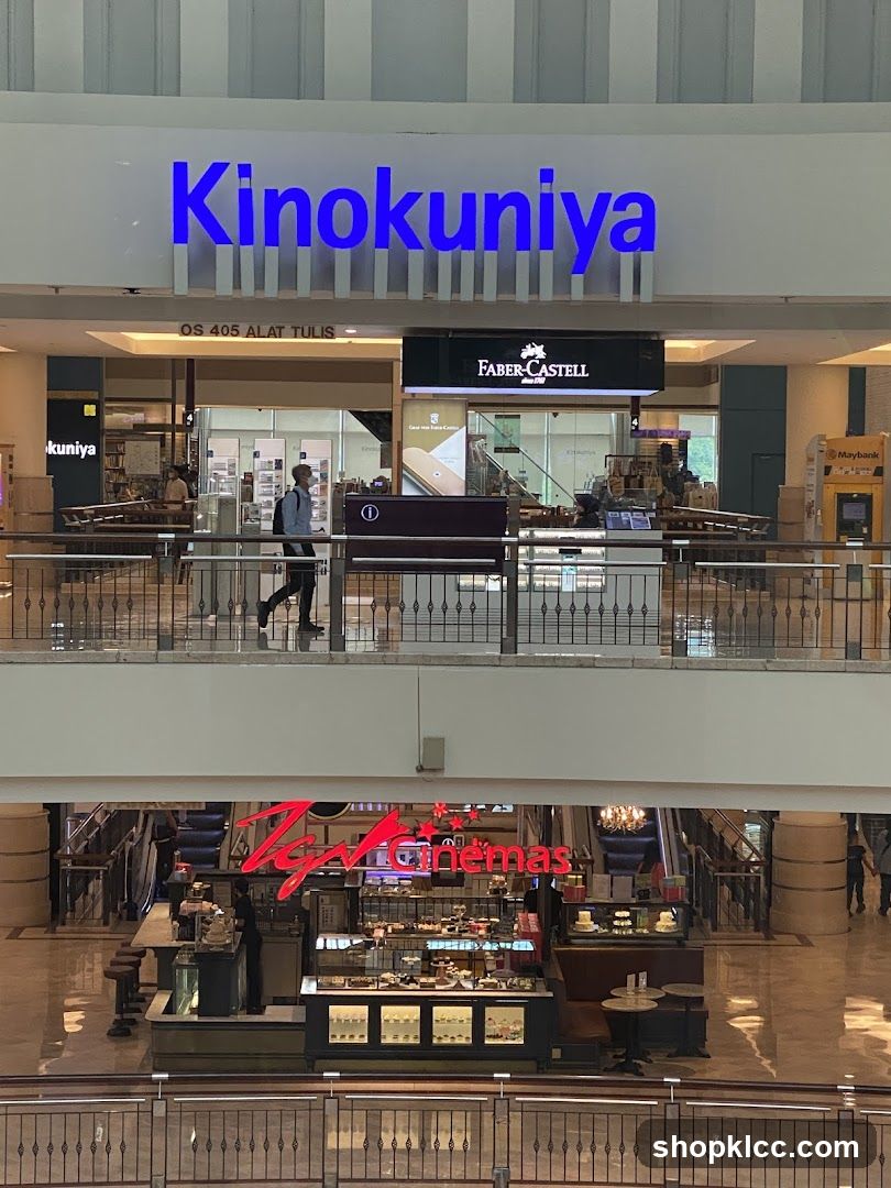 Interior of a shopping mall with stores and a cafe