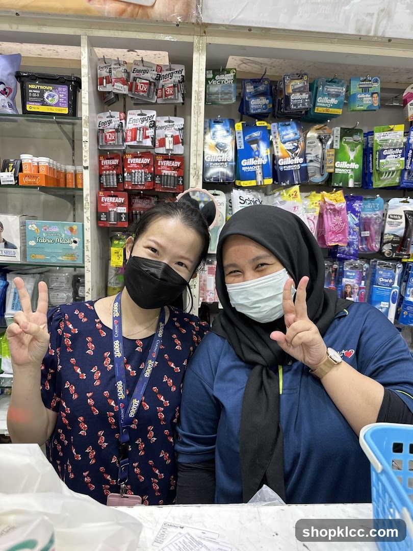 Two women posing in a store
