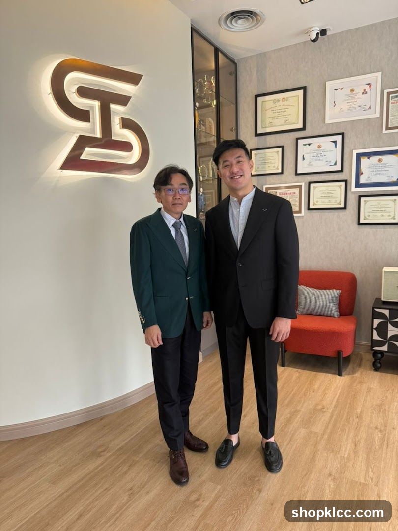Two men in suits standing in an office