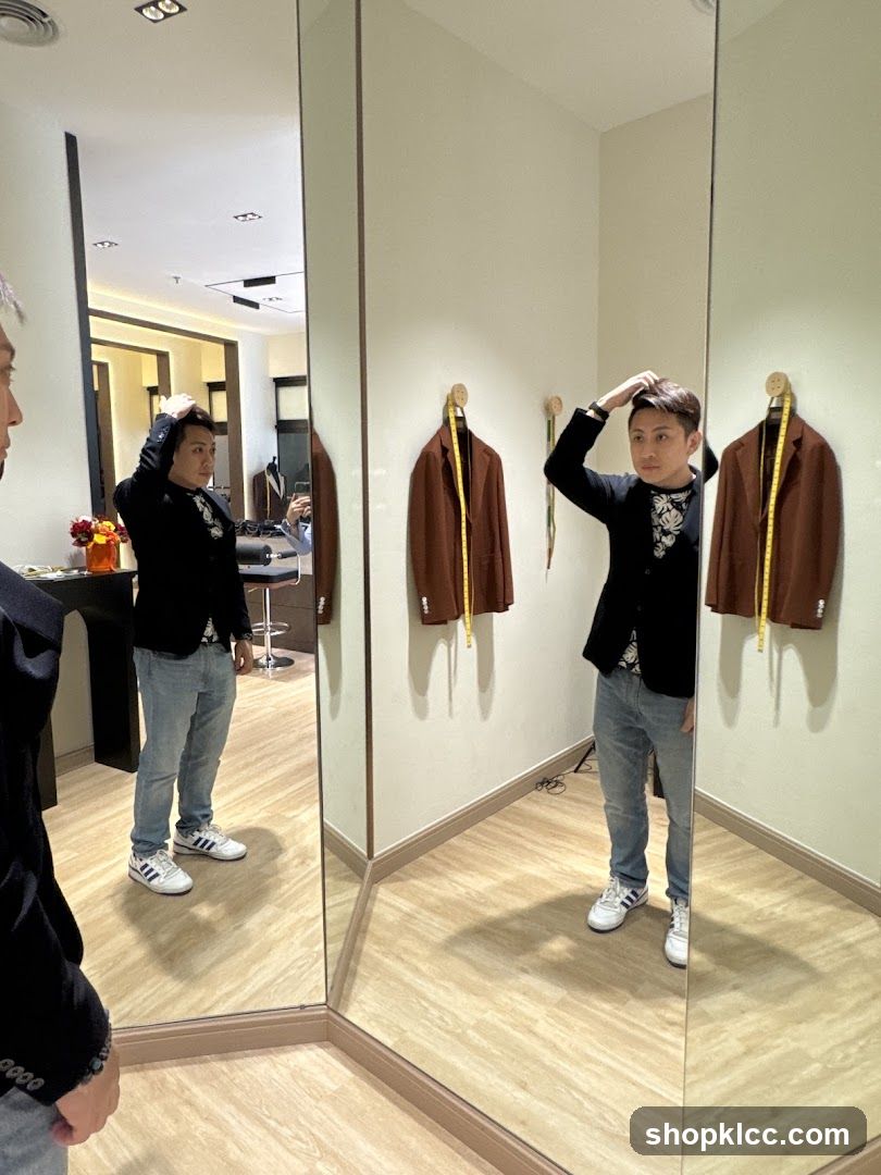 Man trying on a jacket in a fitting room