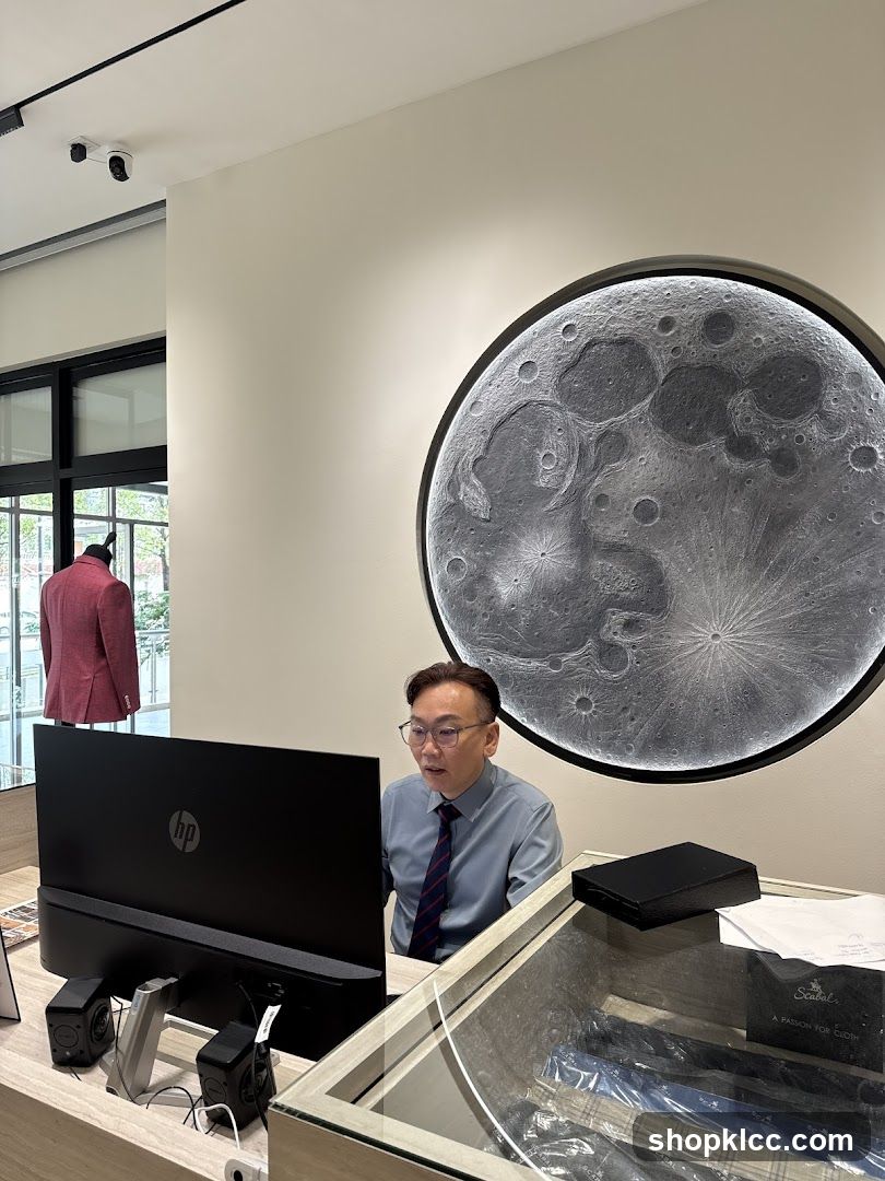 Man working at a desk in a store