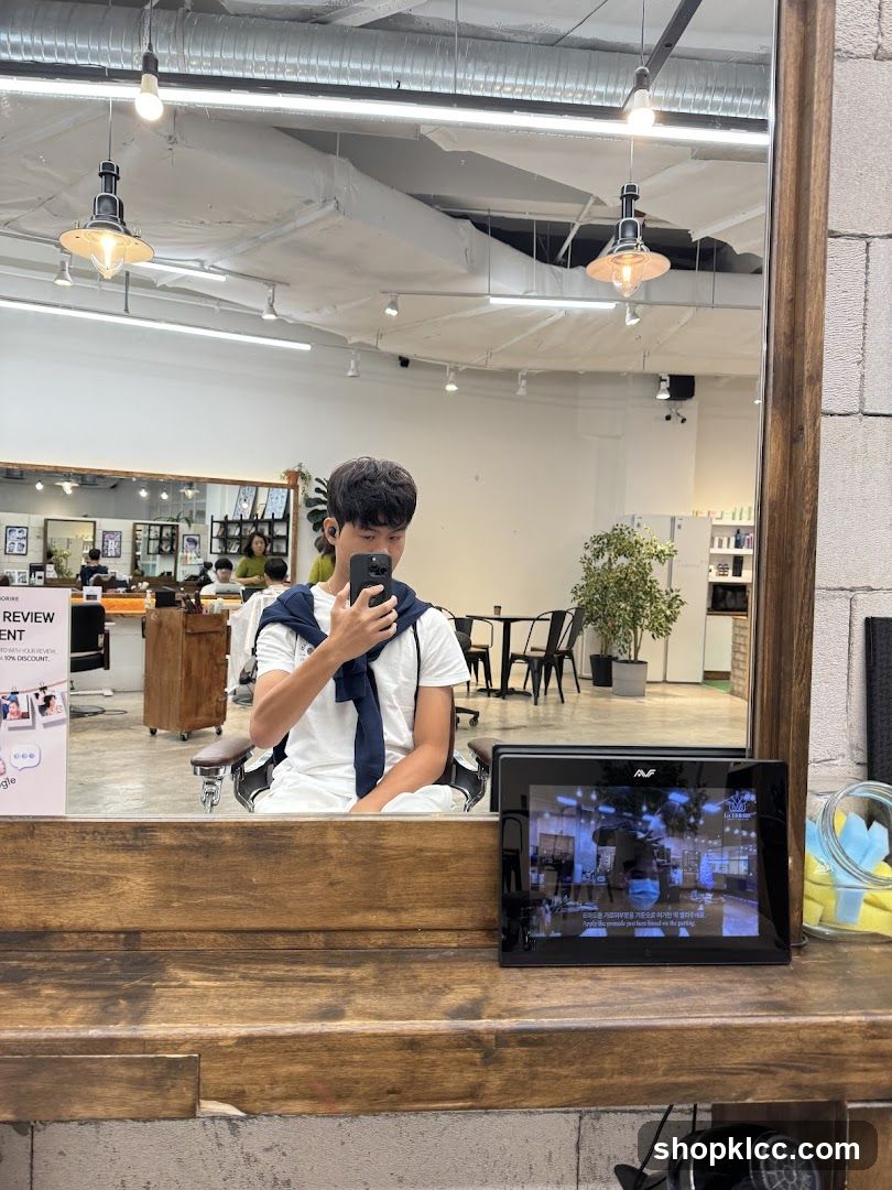 Man taking a selfie in a salon