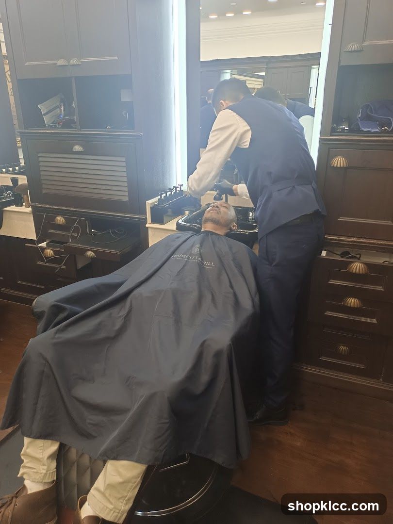 Barber washing client's hair