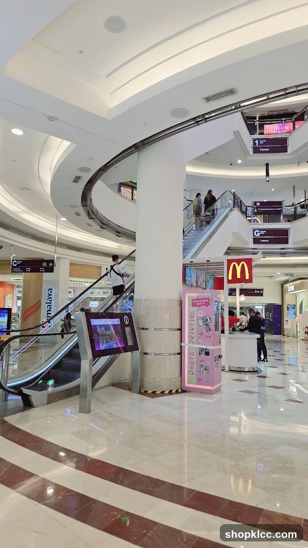 Mall Interior with Escalators and Photo Booth