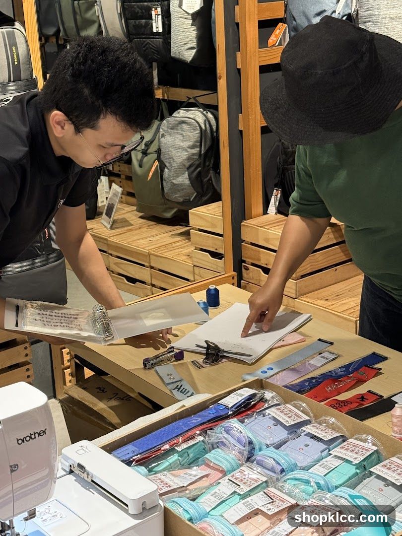 Two people examining items on a table