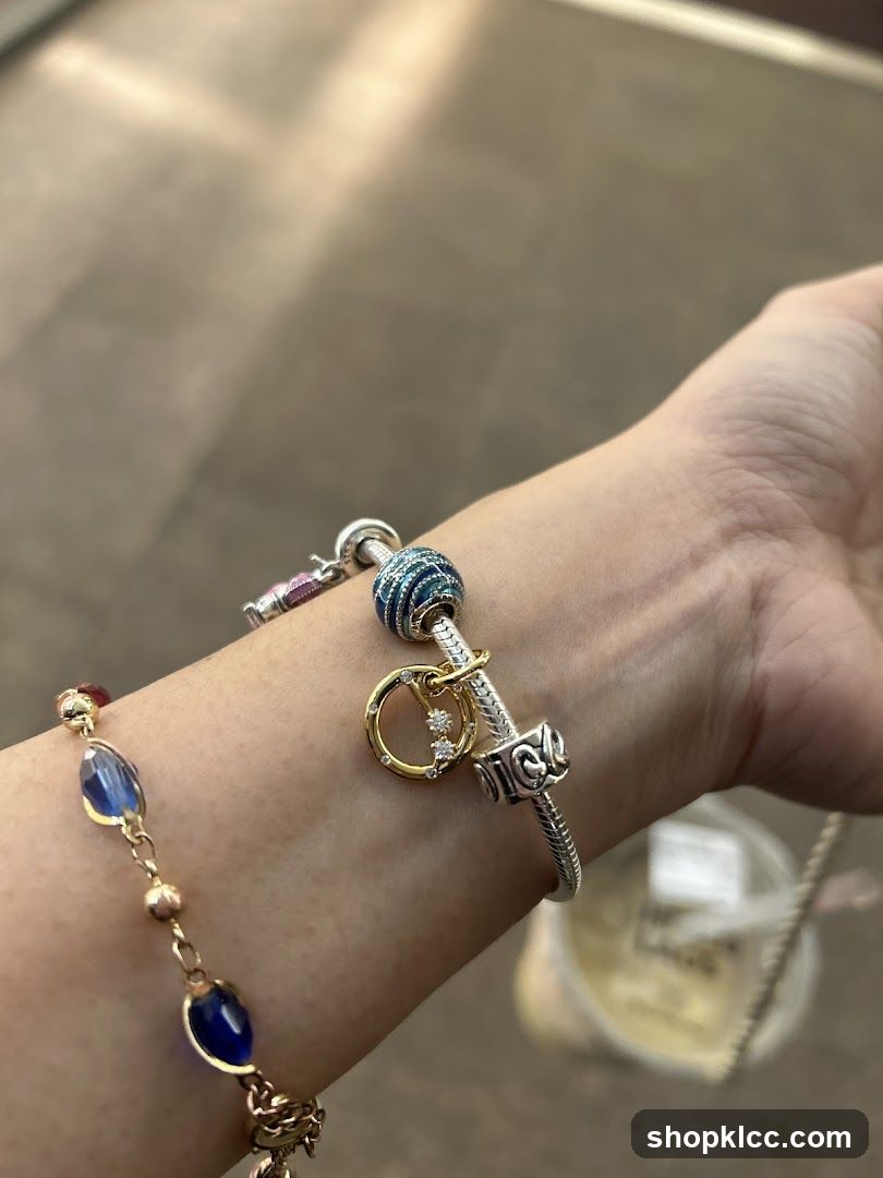Charm bracelet with blue and gold charms