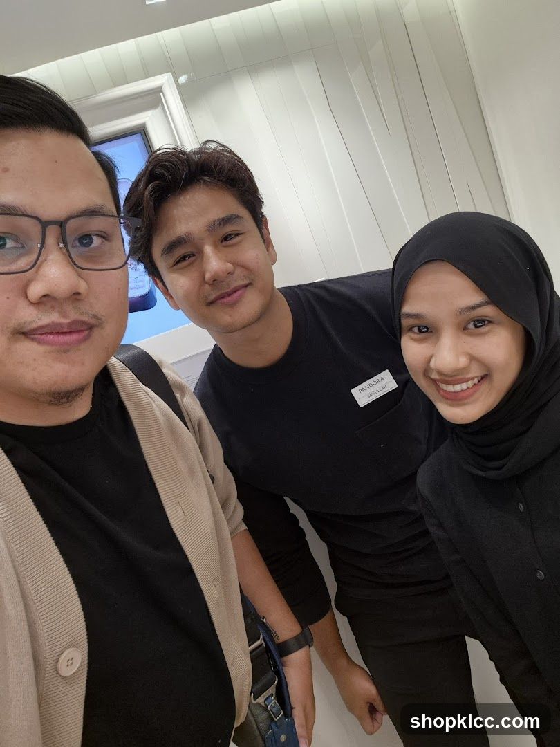 Three people smiling for a selfie