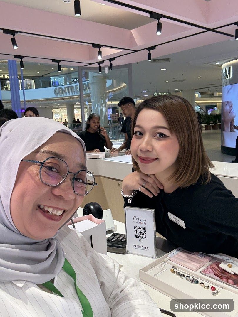 Two women smiling in a jewelry store