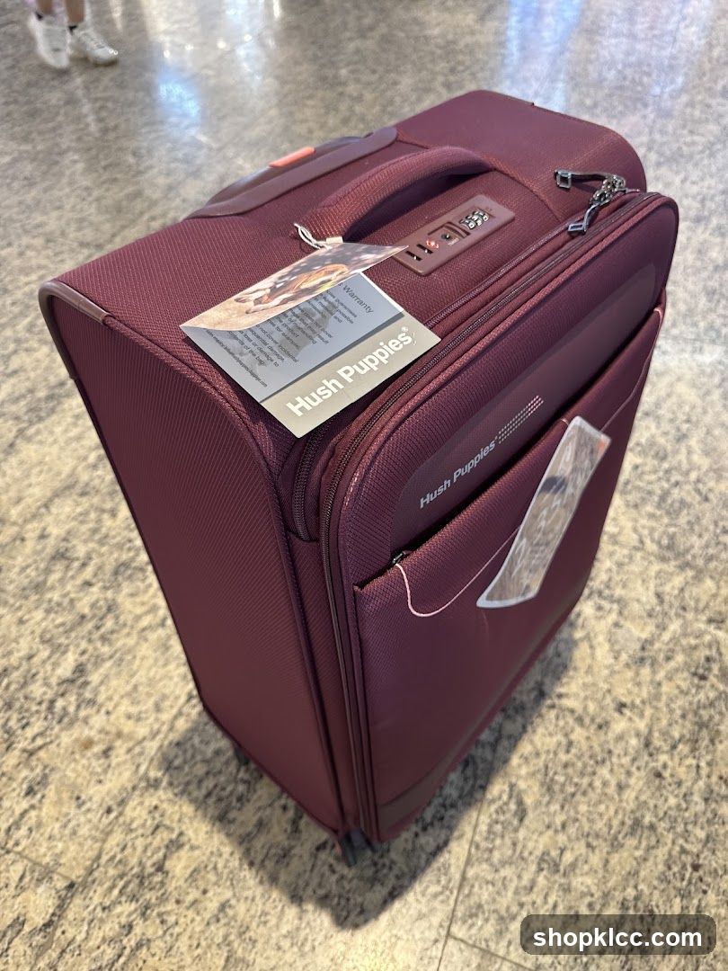 Maroon Suitcase with Hush Puppies Branding