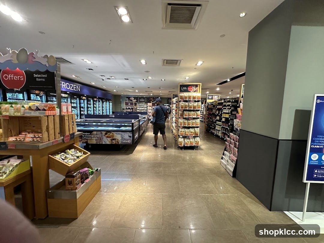 Supermarket aisle with frozen food and shelves of products