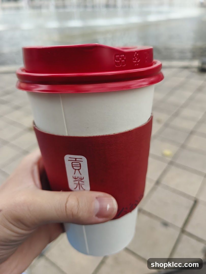 Cup with red sleeve