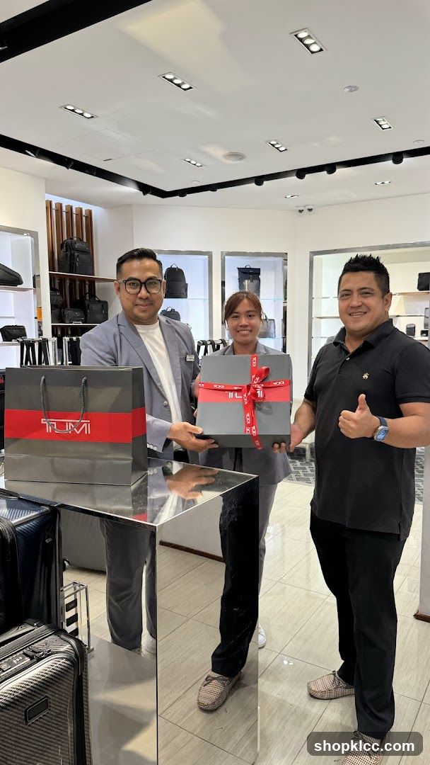 Tumi Store Staff Presenting Gift