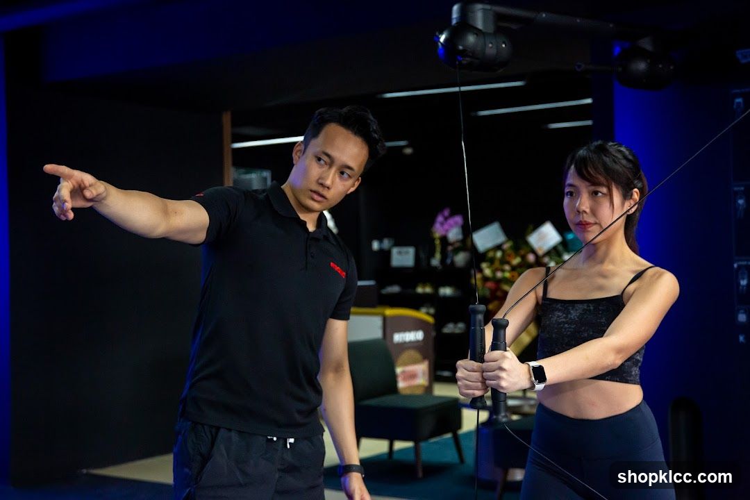 Fitness Instructor Assisting Client