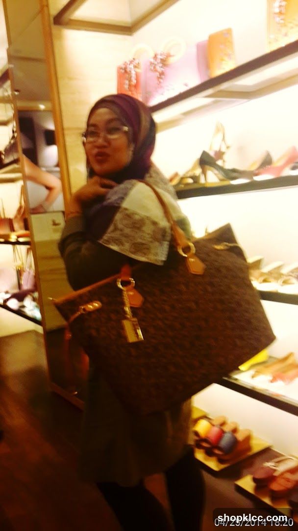 Woman with handbag in a store