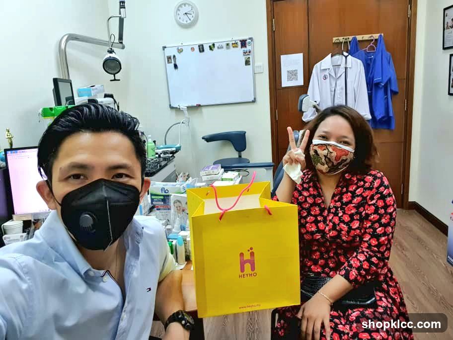 Two people in a room with medical equipment