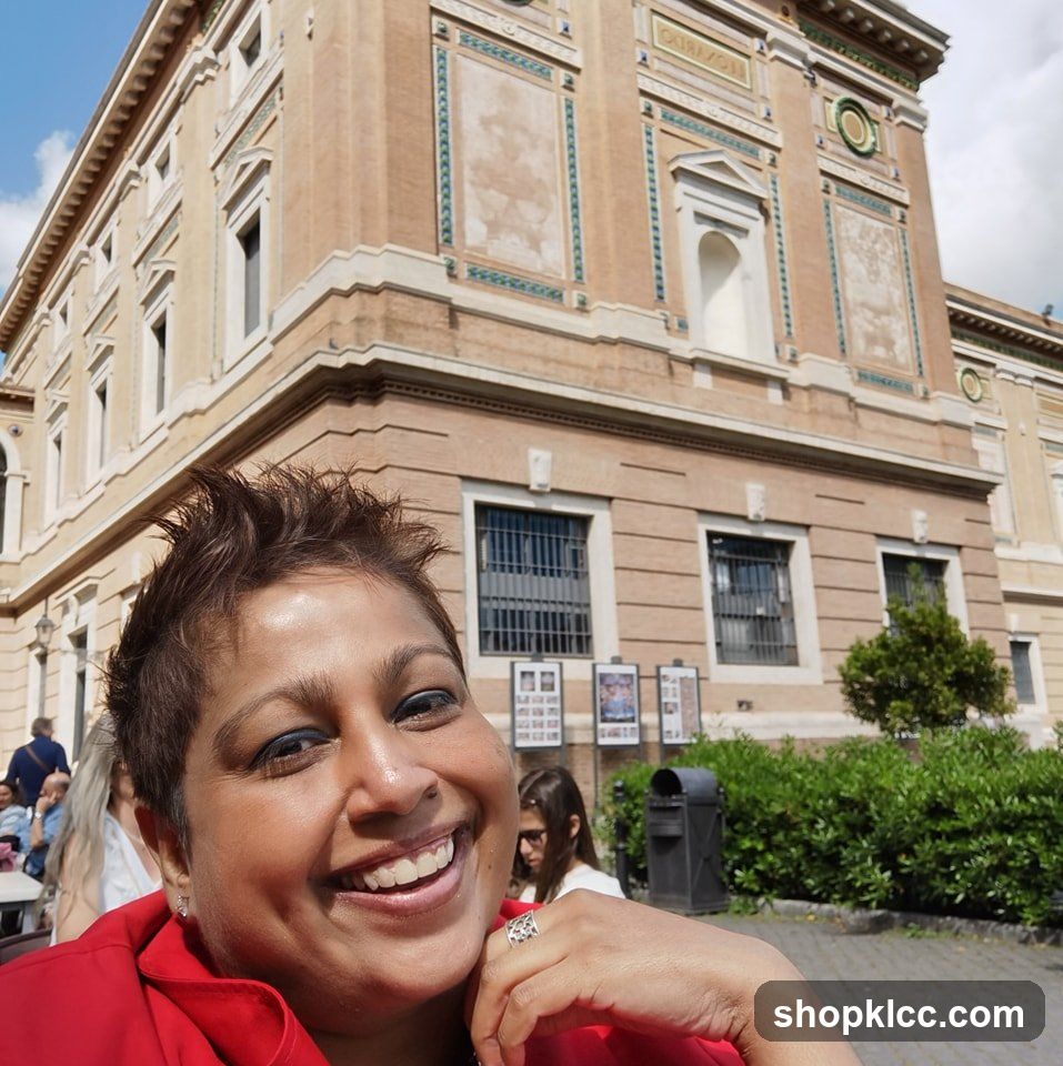 Woman smiling in front of a building