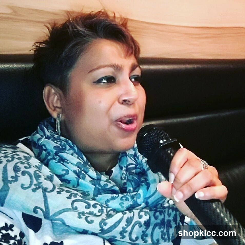 Woman singing into a microphone