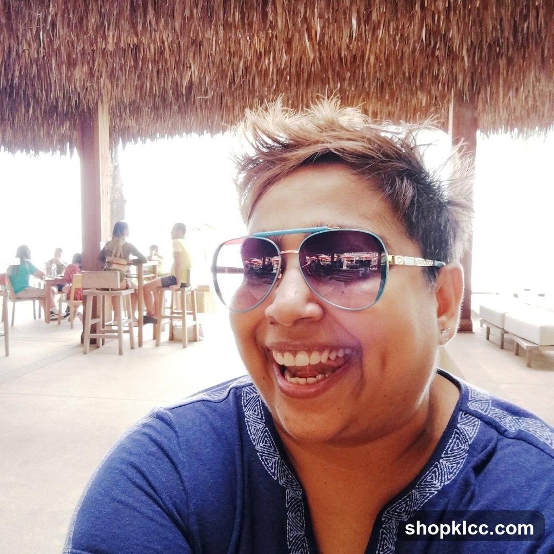 Woman wearing sunglasses at a beachside establishment