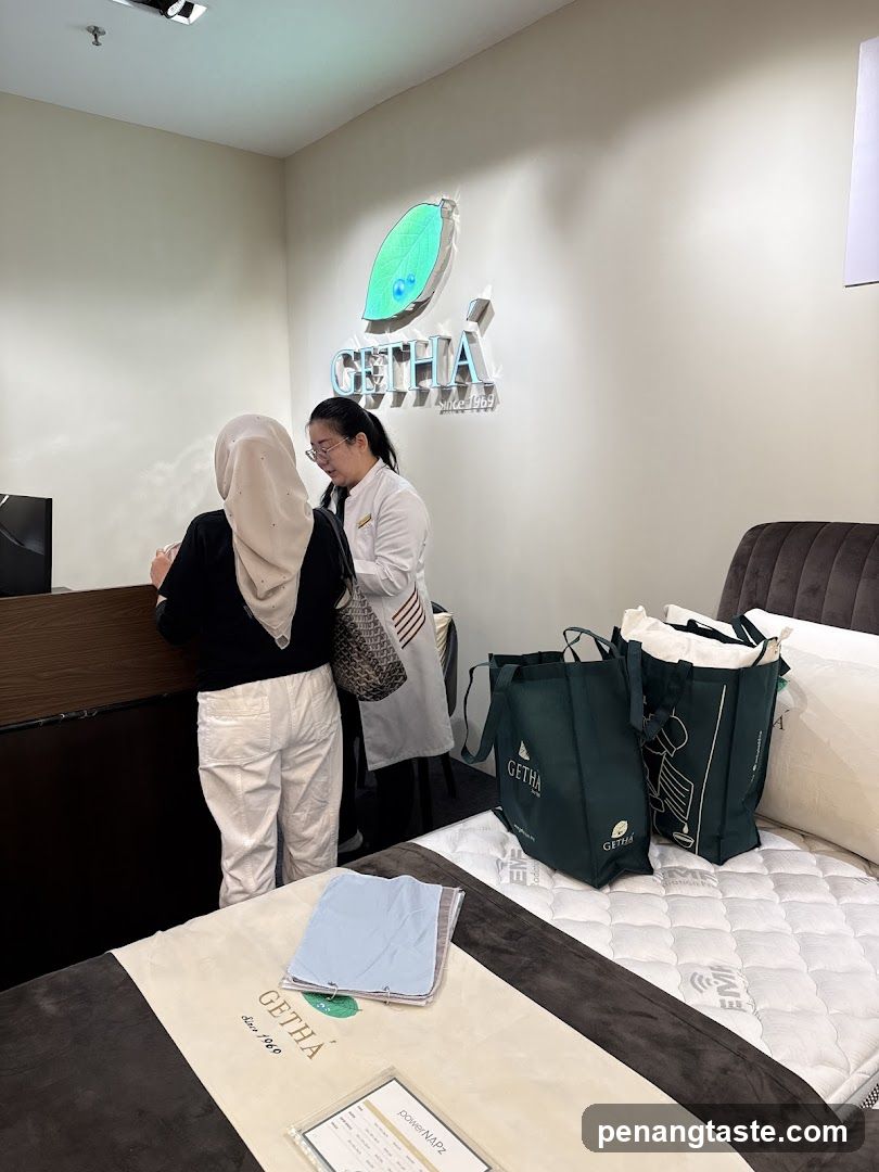 Salesperson assisting customer in a mattress store