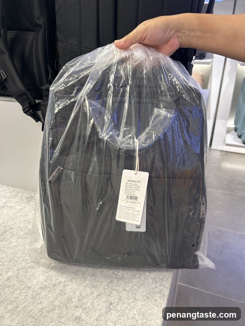 Black Backpack in Plastic Packaging