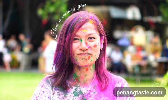 Woman covered in colorful powder