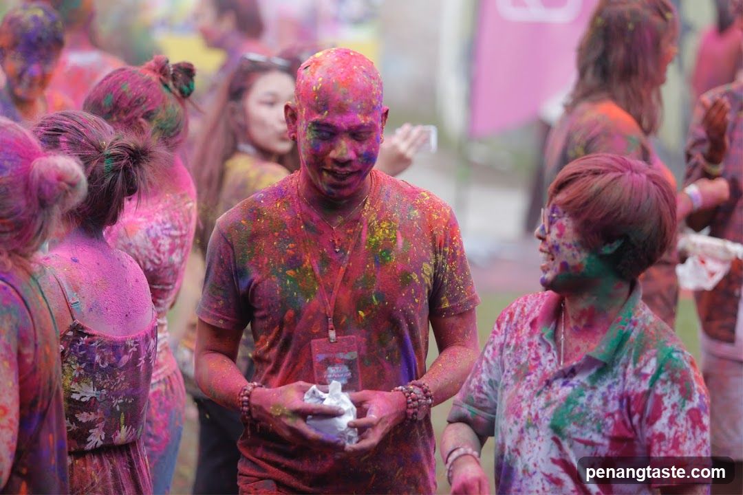 People covered in colorful powder