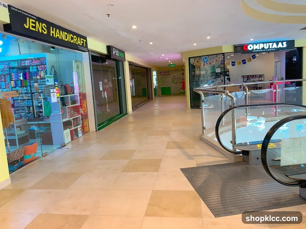Shopping mall interior with shops and escalators