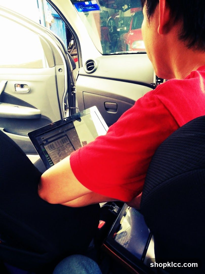 Person using laptop in car