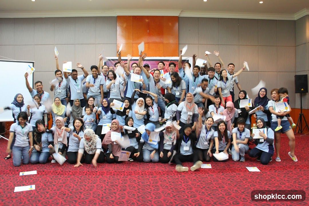 Group celebrating with certificates