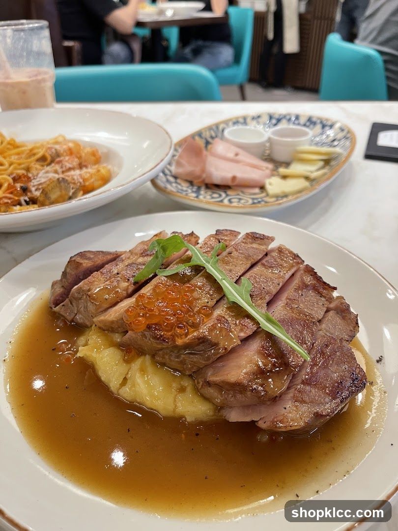 Sliced duck breast with mashed potatoes and sauce