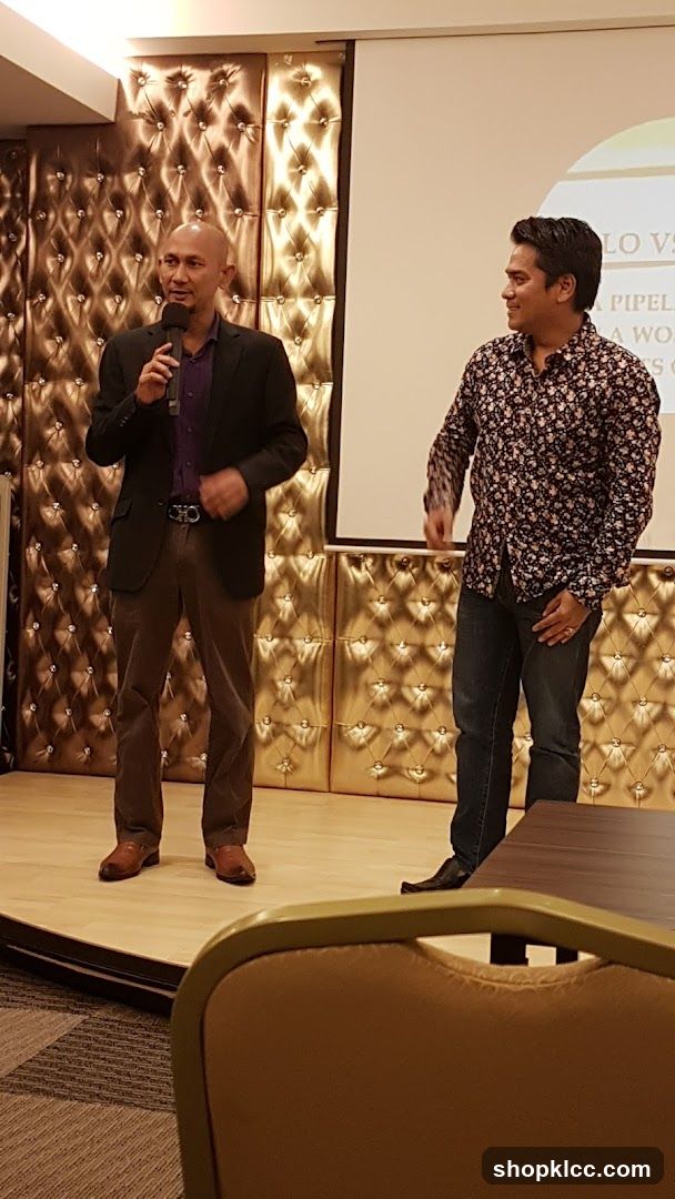 Two men on stage at an event