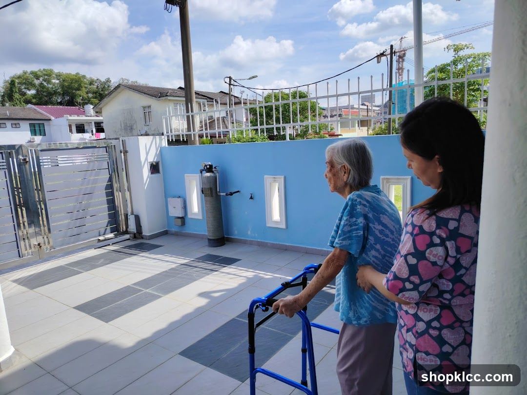 Elderly woman with walker and caregiver