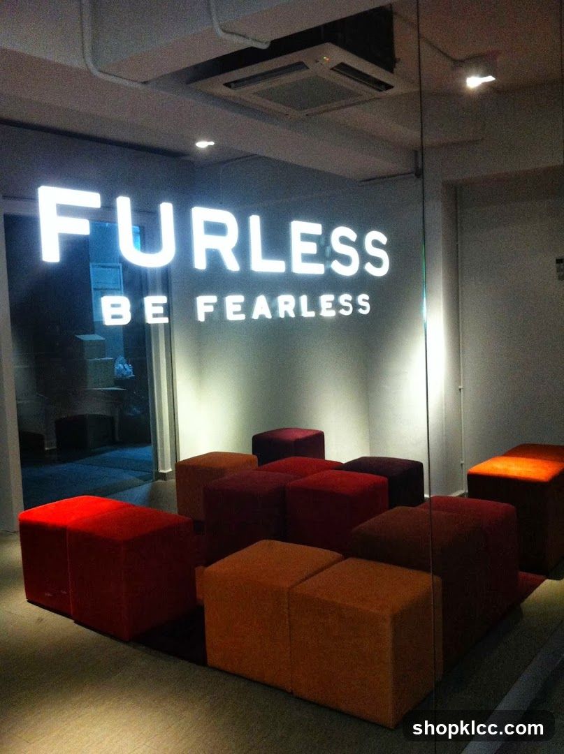 Interior with illuminated sign and seating