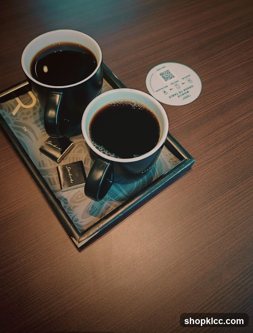Two cups of coffee and chocolates