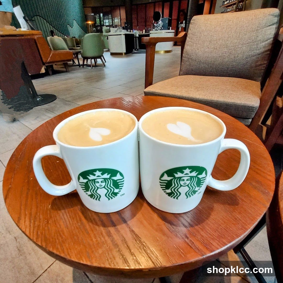 Two lattes with latte art on a table