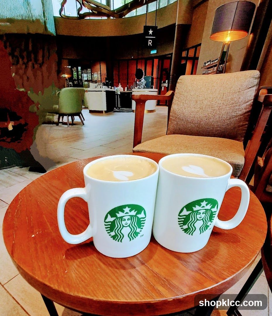 Two coffees with latte art on a wooden table