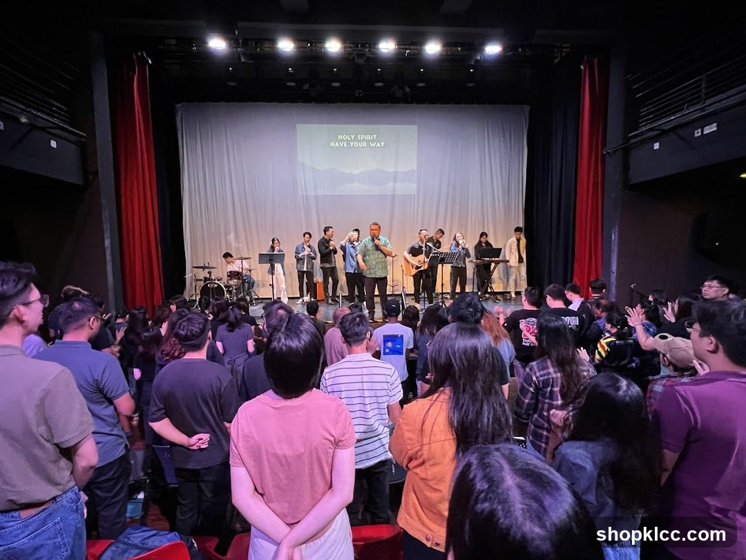 Congregation singing along to worship lyrics on screen